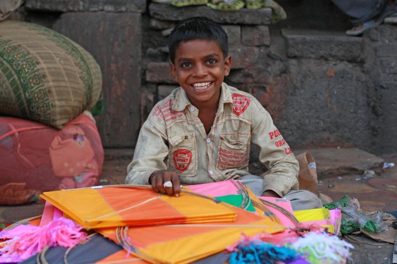 A boy happy selling kites, International Kite Festival