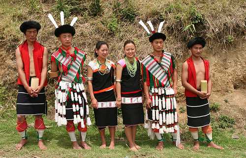 Kachin or Jingpo People in Traditional Clothes Wear Traditional Wicker Hats  with Wild Boar Tusks. a Woman Wears a White Headdress. Editorial Stock  Image - Image of folk, jingpo: 261564474